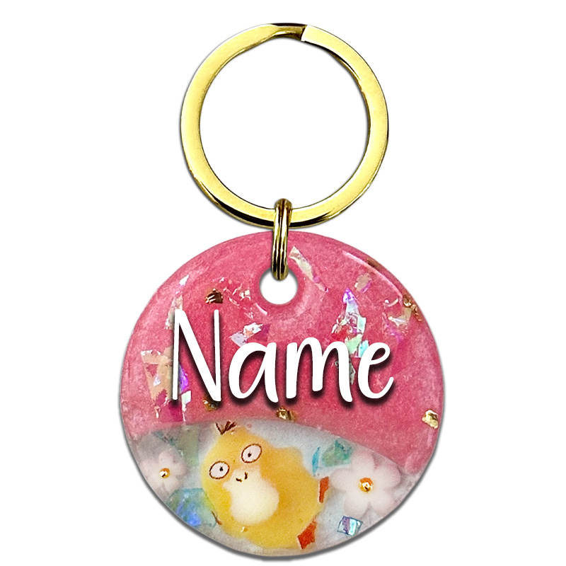 A picture of Schnapp sie dir alle, denn diese Marke ist ein guter Fang! Ein stylisches Split-Design aus glänzendem pinken Perlpigment, einem klaren Bereich mit einer kleinen Figur, Blumen und funkelnden Highlights aus goldenen Glitzersteinen sowie Aurora Flakes.